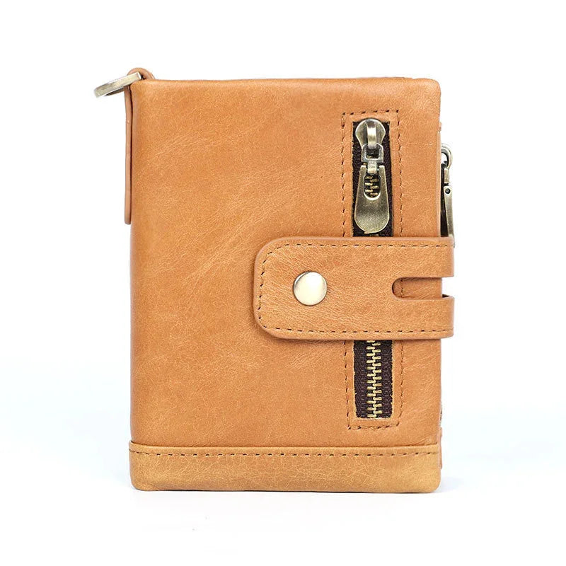 Tan leather wallet with snap button strap and vertical zipper pocket, minimalist design