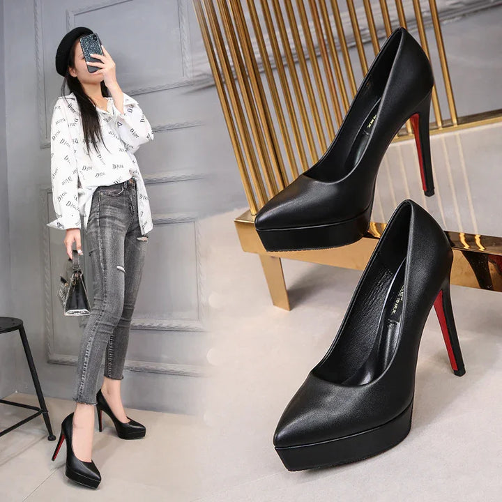 Black high heel platform pumps with red soles displayed and worn by a woman in casual outfit