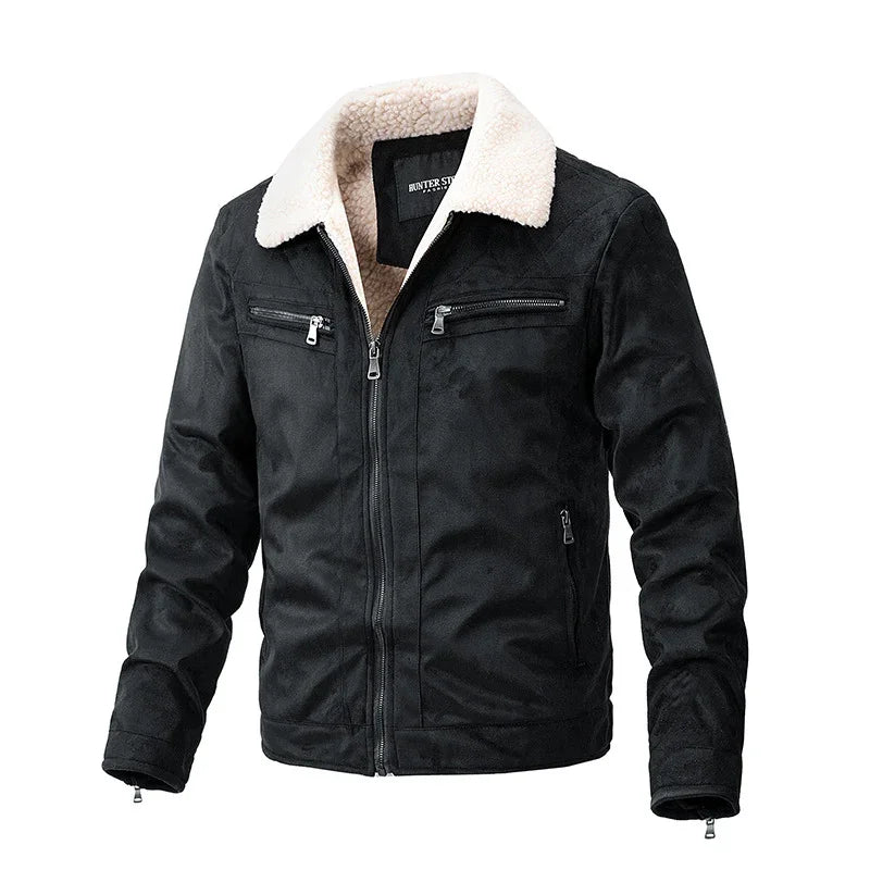 Black suede jacket with white sherpa collar and multiple zippered pockets on white background
