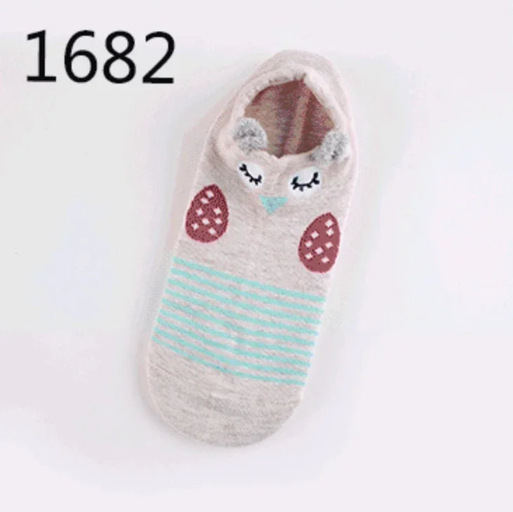 Single beige slipper sock with sleepy owl face and turquoise striped body, number 1682 in corner