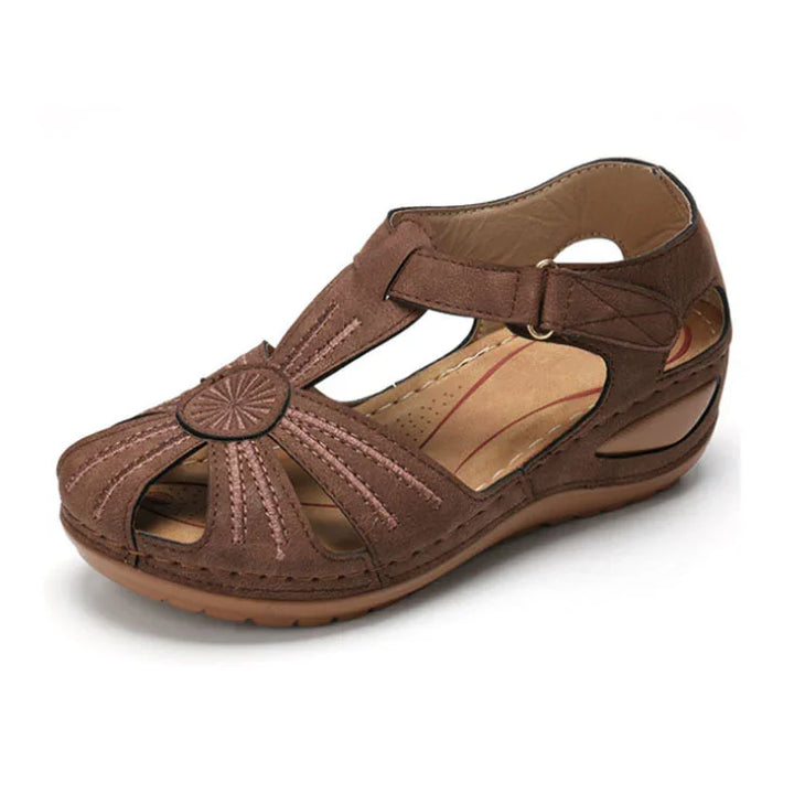 brown leather open-toe women's sandal with decorative stitching and cushioned sole