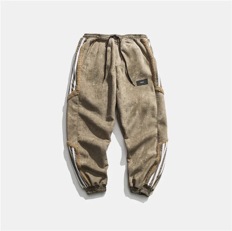 Beige fleece jogger pants with elastic cuffs, black drawstring, side pockets, and white stripes