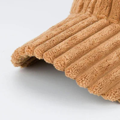 Close-up of brown ribbed knit fabric with soft, textured, corduroy-like appearance