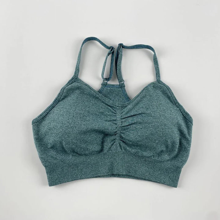 Heather gray seamless sports bra with adjustable double straps and ruched center detail