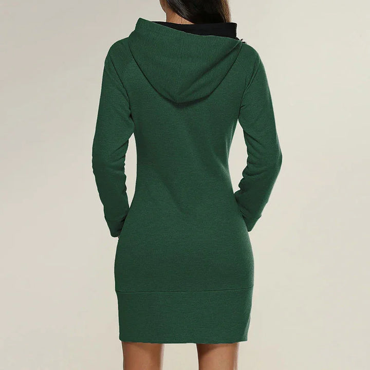 Back view of a woman wearing a fitted green hoodie dress with long sleeves and a hood