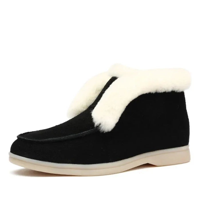 Black suede winter boot with white plush shearling lining and beige sole