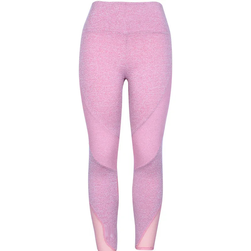 High-waisted pink seamless leggings with mesh panel accents, ideal for workout or yoga