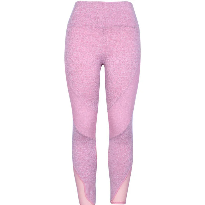 High-waisted pink seamless leggings with mesh panel accents, ideal for workout or yoga
