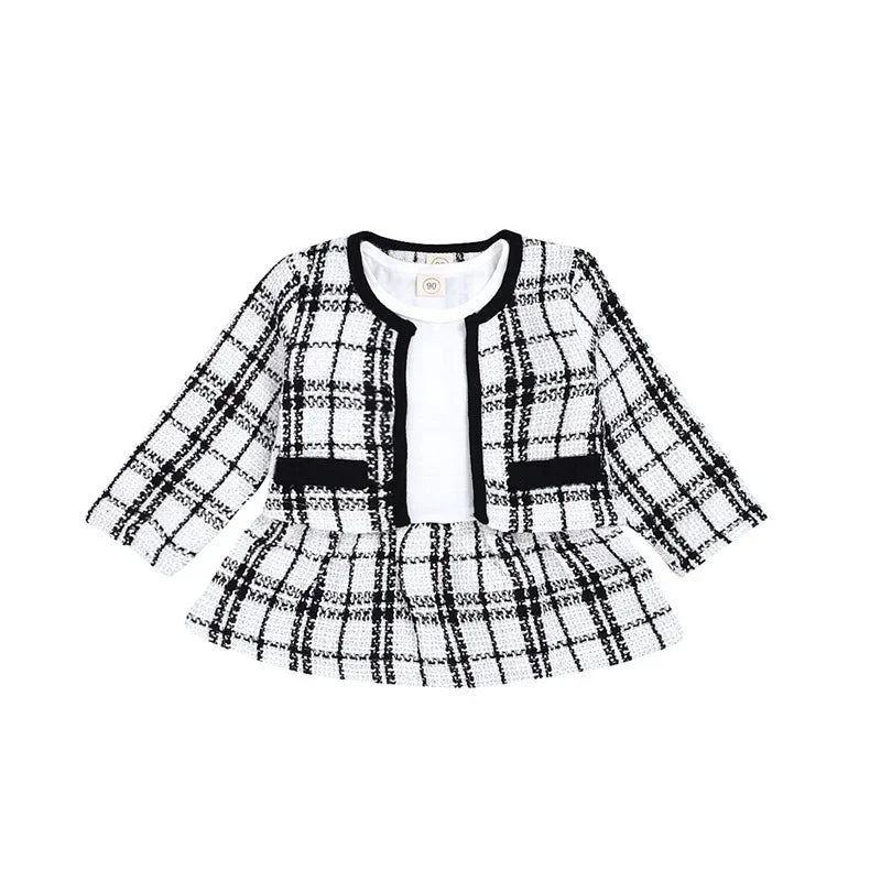 Black and white checkered baby girl's dress with long sleeves and black trim detail