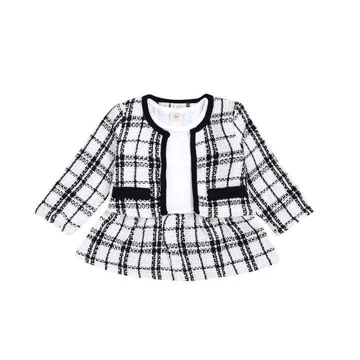 Black and white checkered baby girl's dress with long sleeves and black trim detail