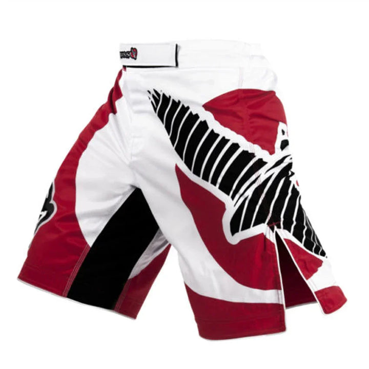 Red, black, and white MMA fight shorts with bold eagle graphic design