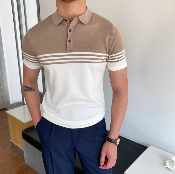 Man wearing beige and white striped short-sleeve polo shirt with navy pants and wristwatch