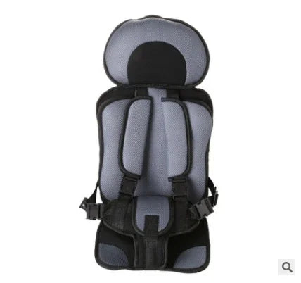 Gray and black padded child car seat with safety harness and headrest on white background