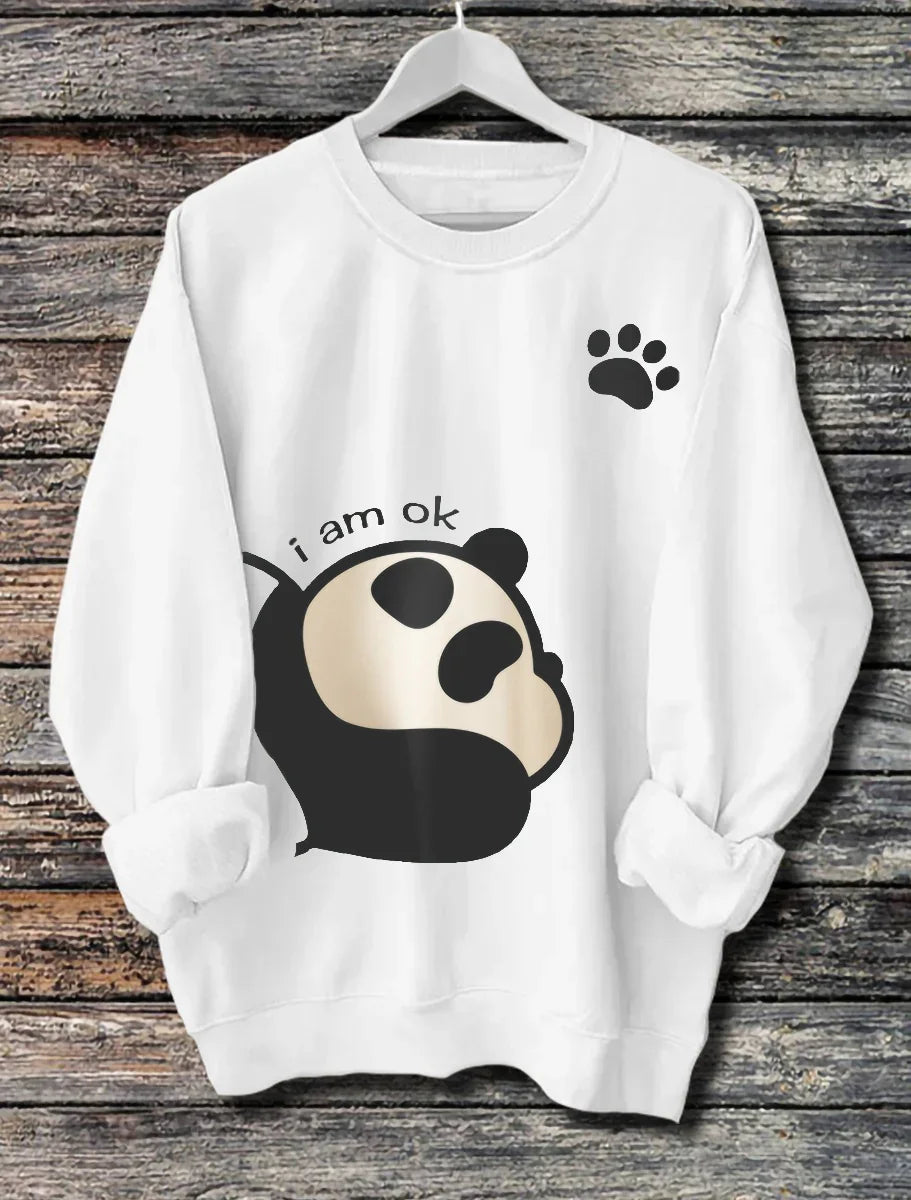 White sweatshirt with a cute black and beige panda graphic and text 'i am ok', plus a black paw print
