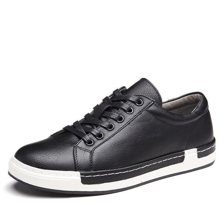 Black leather lace-up casual sneaker with white stitched sole and black accent