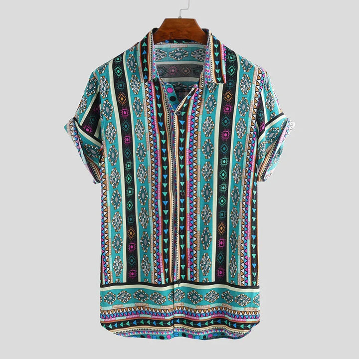 Colorful short-sleeve button-up shirt with geometric tribal patterns on wooden hanger