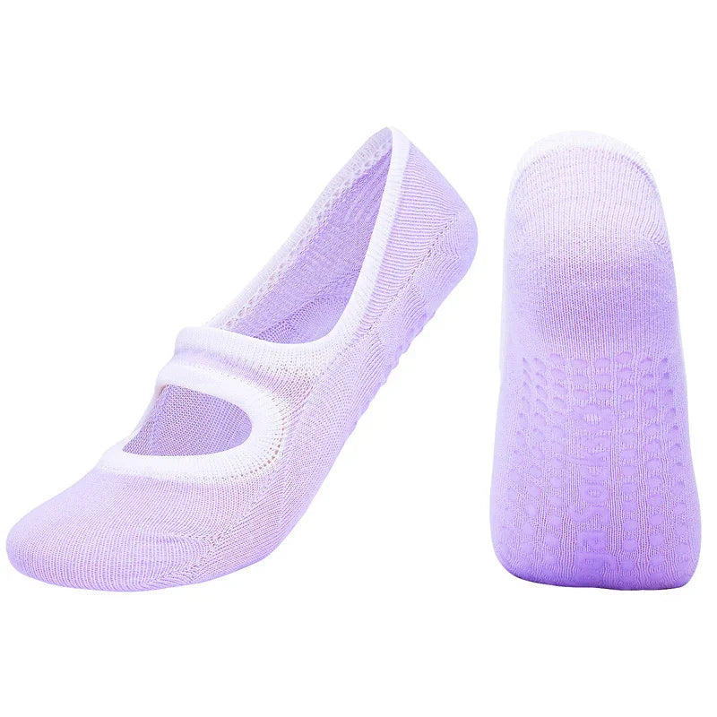 Light purple non-slip yoga socks with white trim and grip dots on soles
