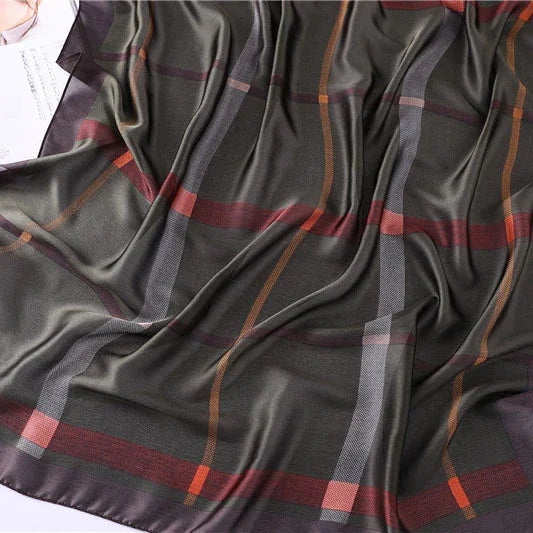 Dark silk scarf with a large plaid pattern in red, orange, gray, and purple tones