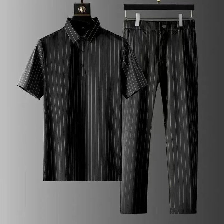 Black pinstripe short-sleeve polo shirt and matching slim-fit trousers on hangers