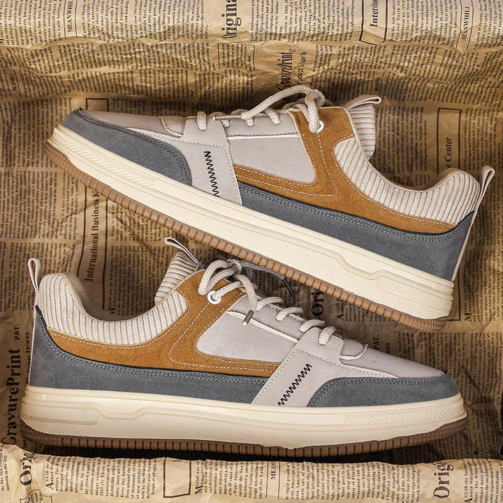 Casual sneakers in beige, brown, and gray with textured fabric and white laces on vintage newspaper background