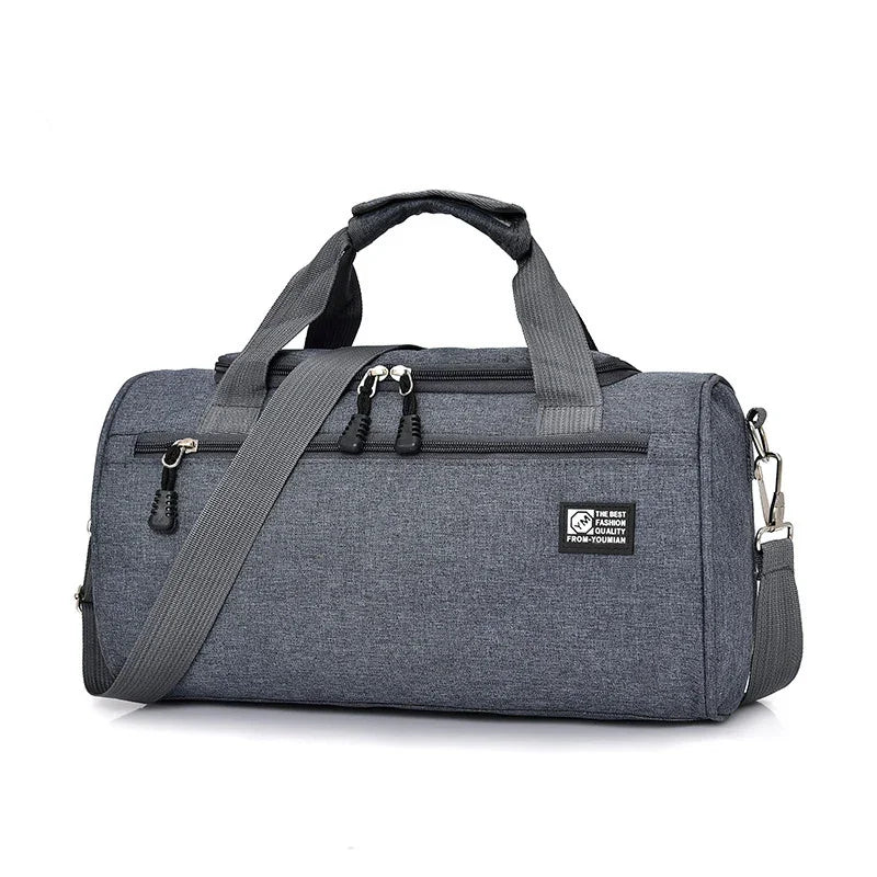 Gray fabric duffel gym bag with handles, adjustable shoulder strap, and front zip pocket