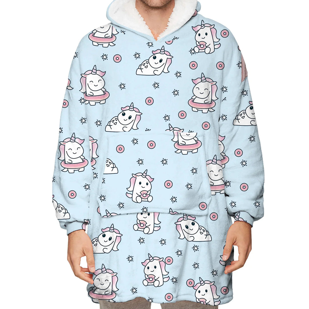 Person wearing a cozy light blue hoodie with cute pink and white unicorn and donut pattern