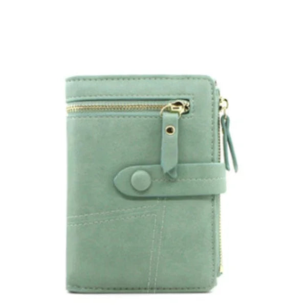 Compact green leather wallet with front zipper pocket and button strap closure