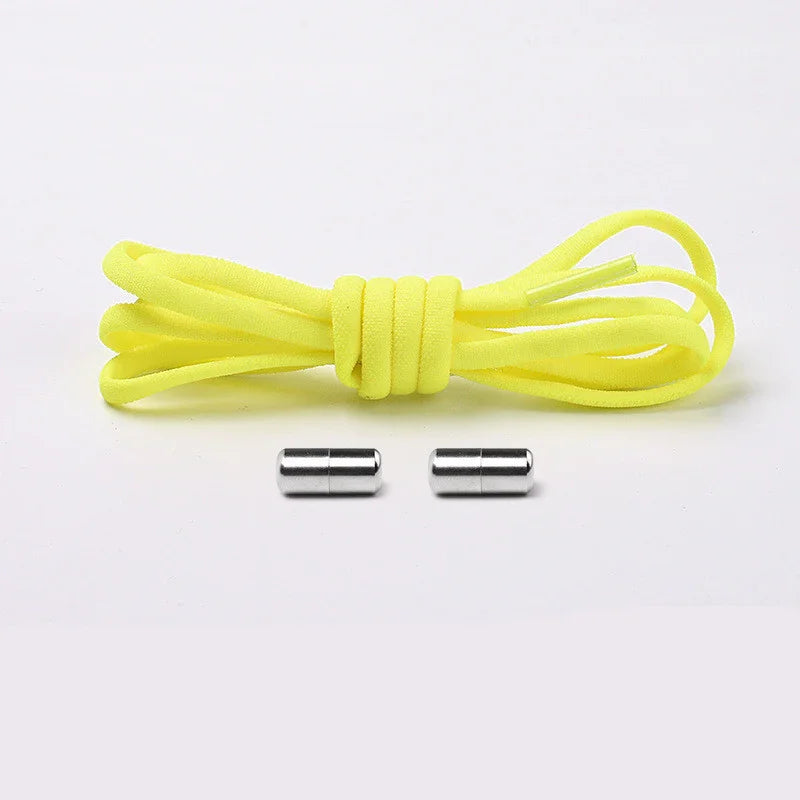Yellow elastic shoelace with two silver metal aglets on a white background