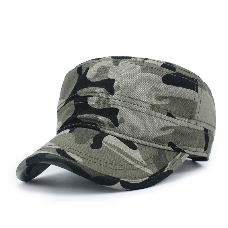 Green and black camouflage military cap with curved brim on white background