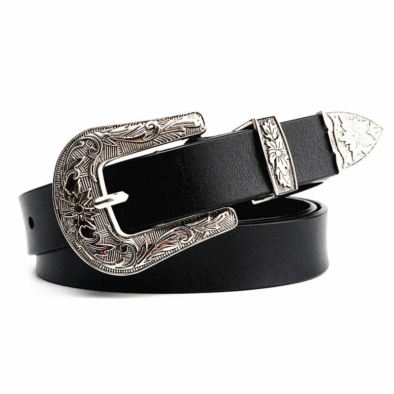 Black leather belt with engraved silver western-style buckle, loop, and tip