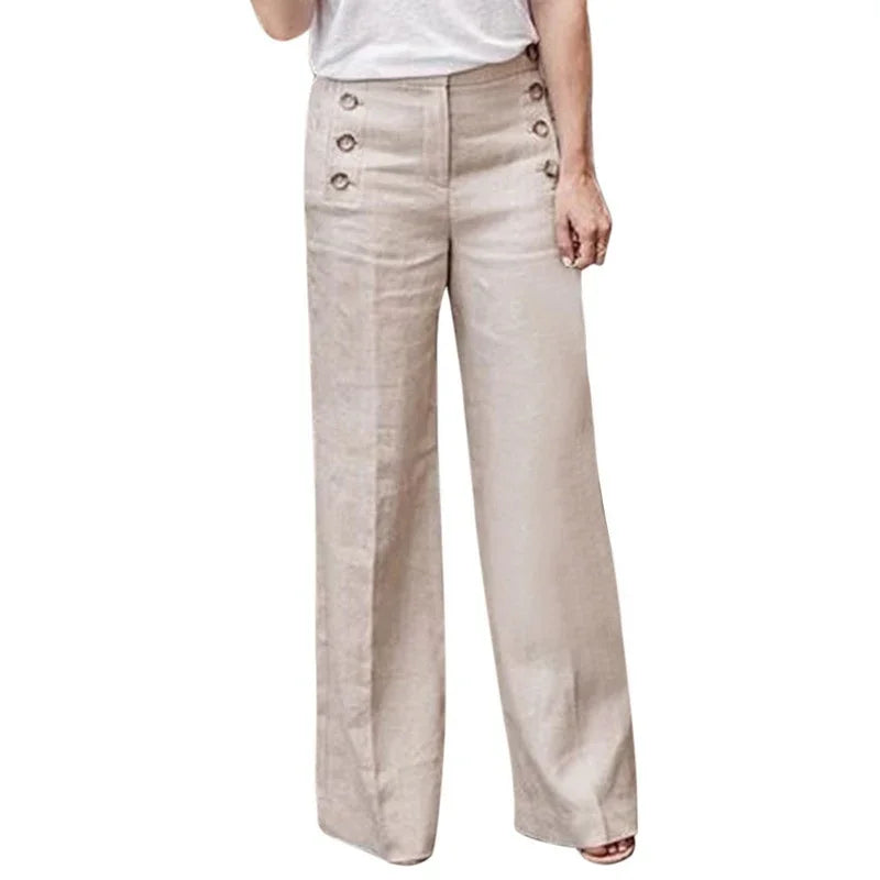 Beige high-waist wide-leg pants with button details paired with a white top