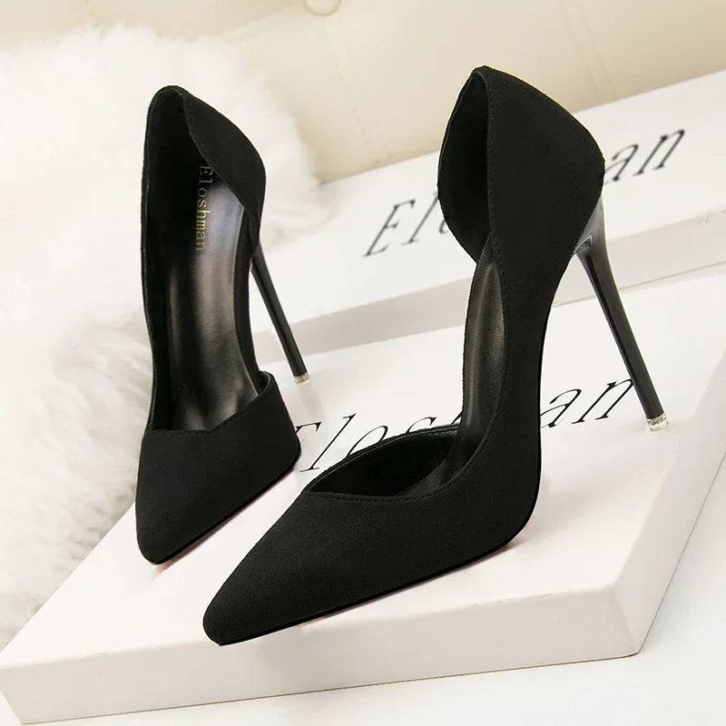 Elegant black high heel stiletto shoes with pointed toes displayed on white boxes