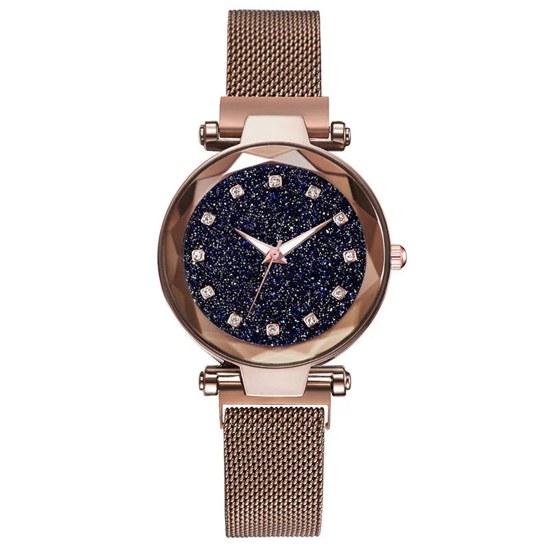 Rose gold mesh strap watch with sparkling dark blue starry dial and crystal hour markers