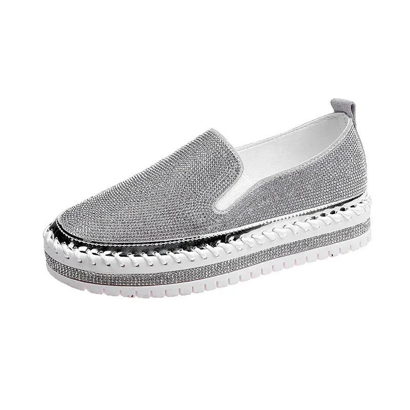 Silver slip-on platform sneaker with rhinestone embellishments and white rubber sole