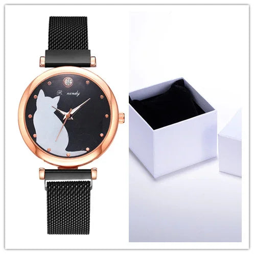 Elegant black mesh strap watch with rose gold case and white cat silhouette on black dial, next to open white gift box
