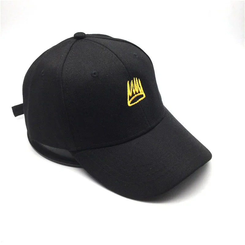 Black baseball cap with yellow embroidered crown logo on front, adjustable strap on back