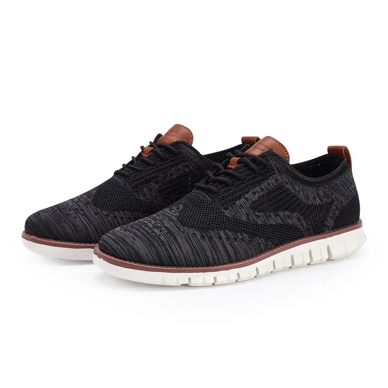 Black knit casual sneakers with white flexible sole and brown leather accents on heel and tongue