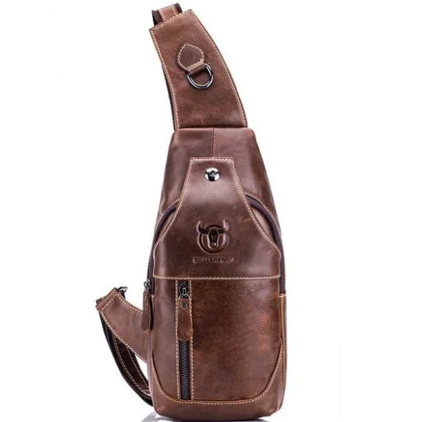 Brown leather sling backpack with front zipper pocket and embossed bull logo