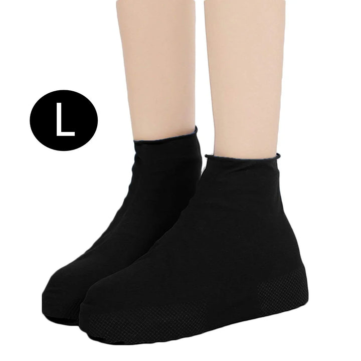 Black ankle-length shoe covers with textured soles on model feet, size large indicated