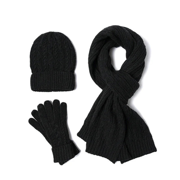 Black knitted winter set including beanie hat, scarf, and gloves with cable knit pattern