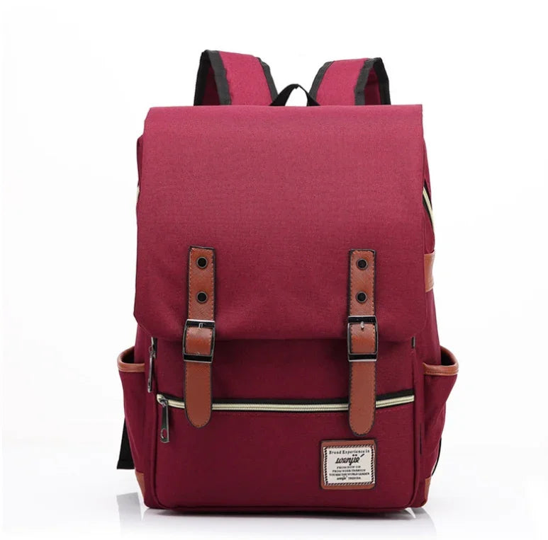 Stylish burgundy backpack with brown leather straps, front zipper pocket, and side pouches for casual use