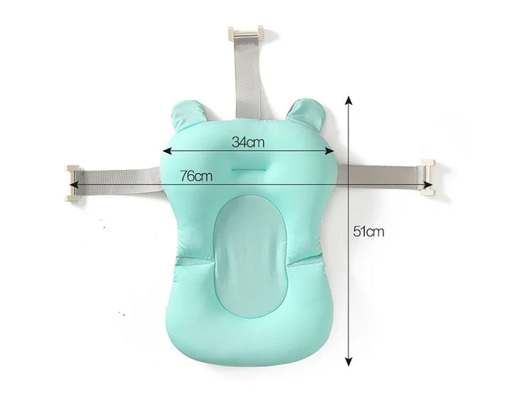 Mint green baby bath support cushion with grey straps and measurement markings
