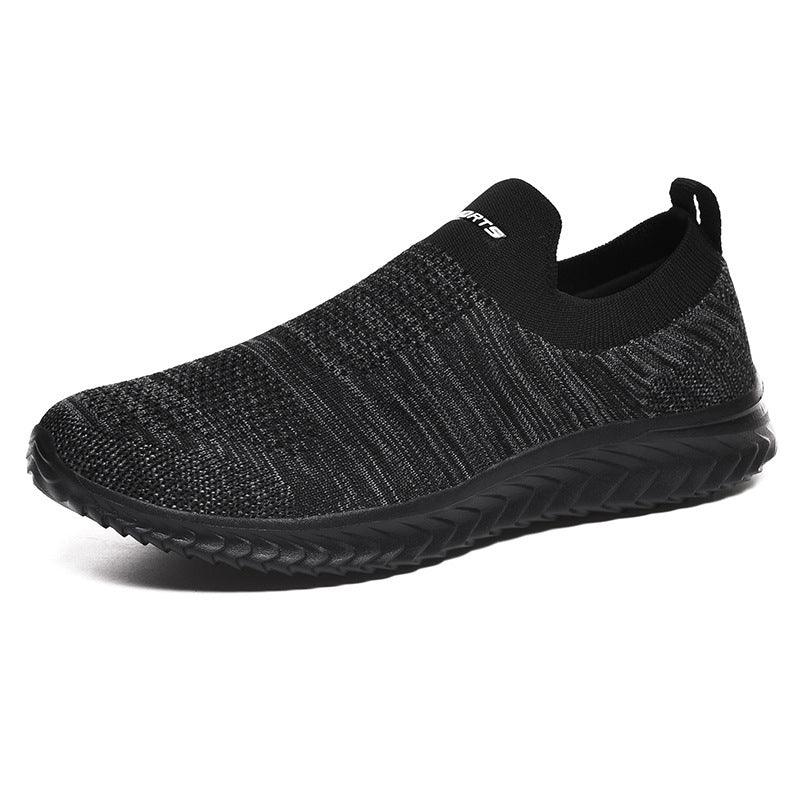 Black slip-on knit sneaker with textured sole and low ankle collar
