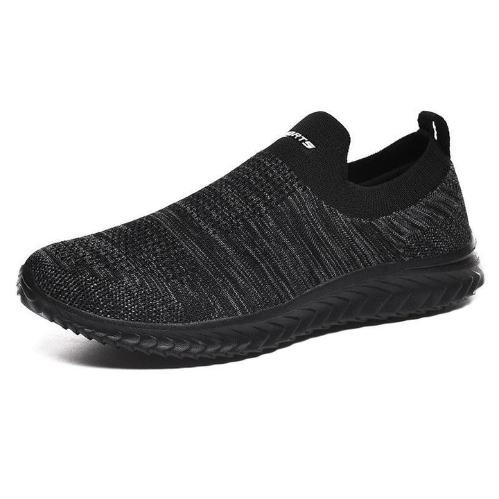 Black slip-on knit sneaker with textured sole and low ankle collar