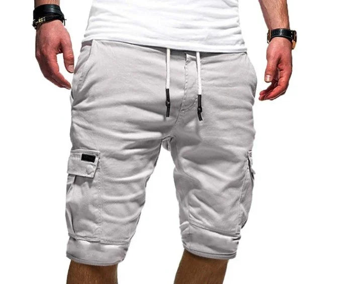 Man wearing white casual cargo shorts with drawstring waist and side pockets