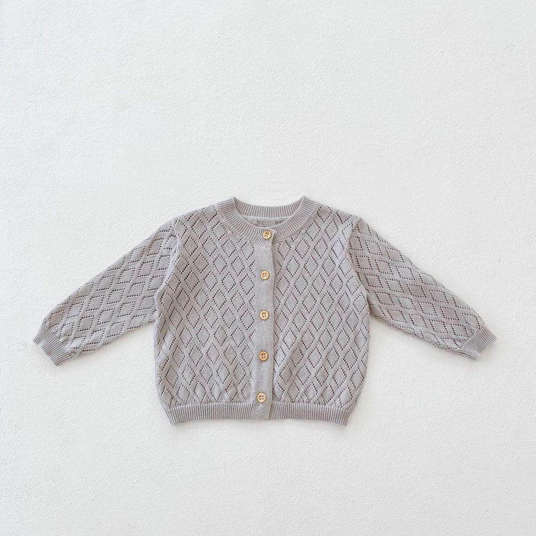 Gray baby cardigan with diamond knit pattern and wooden buttons on white background