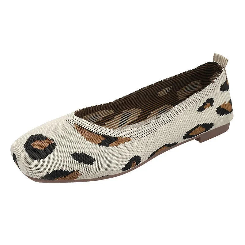 Beige women’s ballet flat shoe with brown and black leopard print pattern and low heel