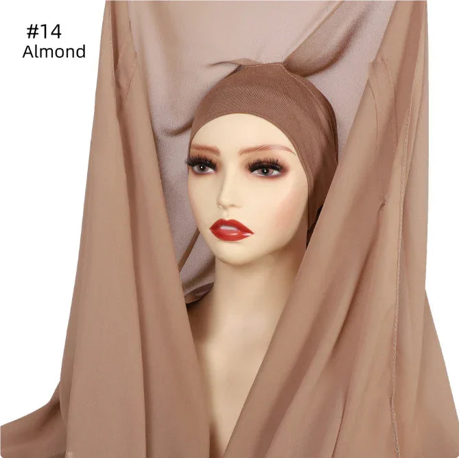 Mannequin head wearing almond color inner hijab and matching almond fabric draped around it
