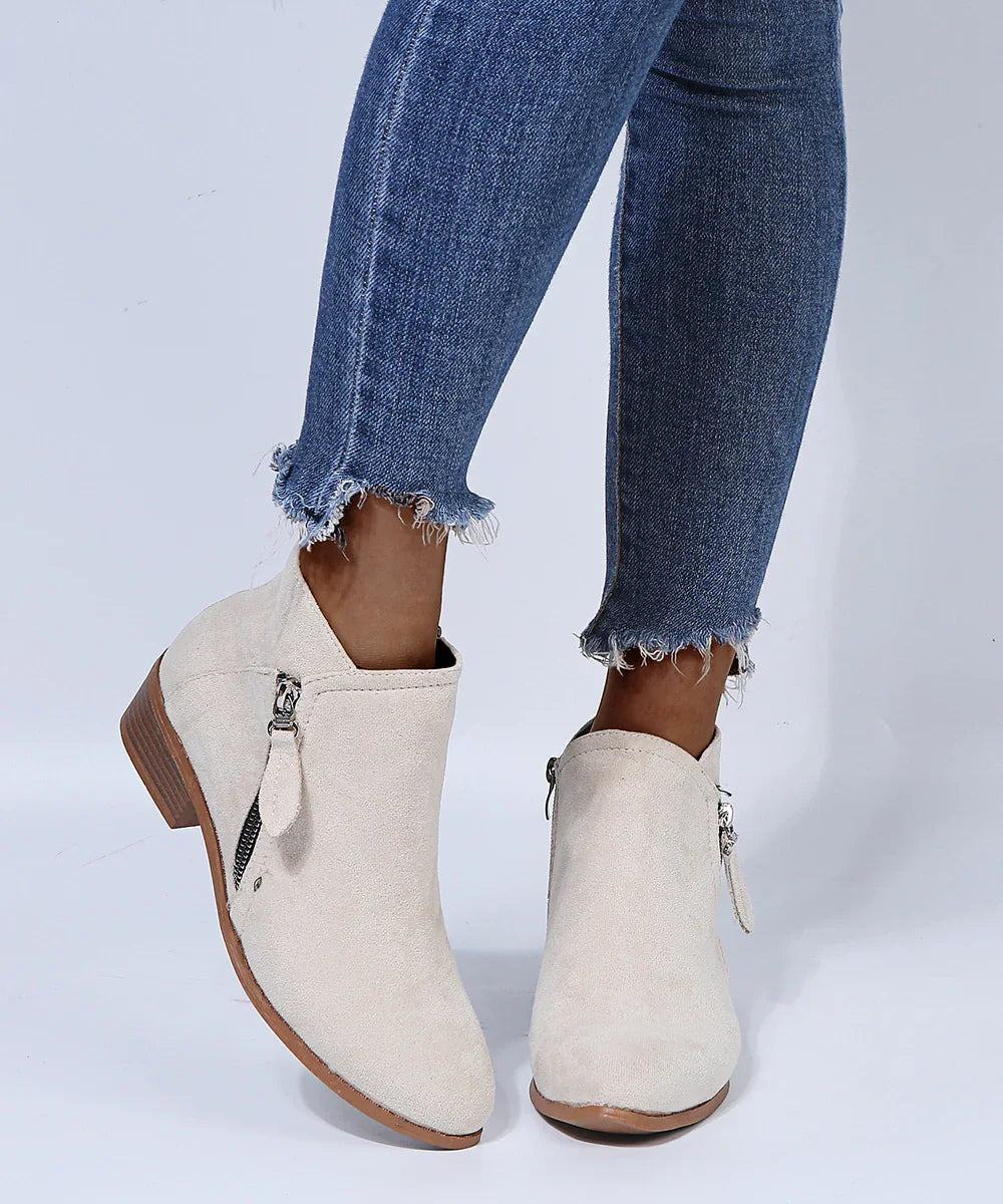 women's beige suede ankle boots with side zipper worn with frayed hem blue skinny jeans