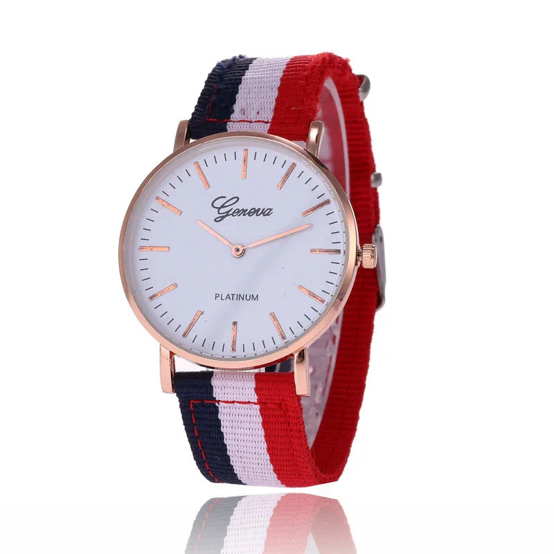 Geneva Platinum wristwatch with rose gold case and red, white, and blue striped fabric strap